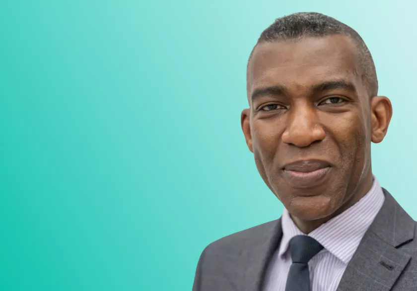 Headshot photo of Rob Okunnu