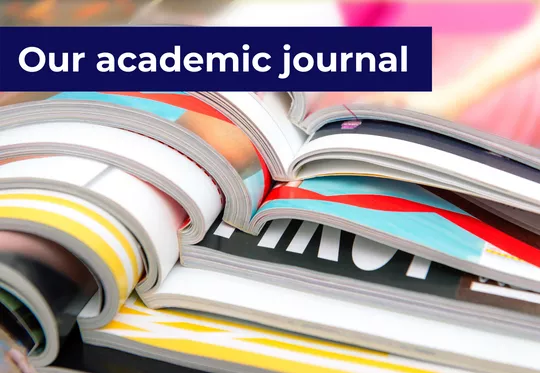 'Our academic journal' - stack of open journals