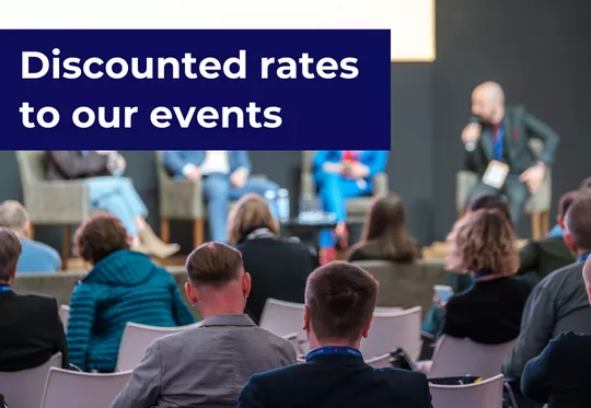 'Discounted rates to our events' - room of people watching presentation