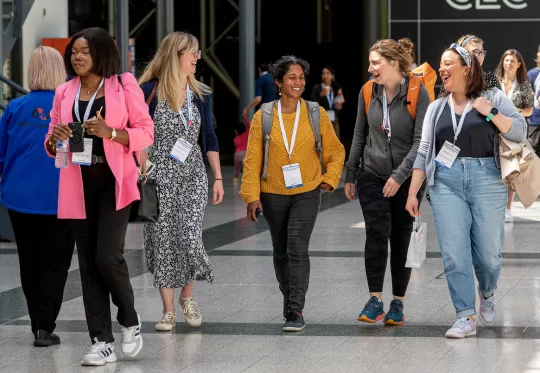 group of young people walking in conference center
