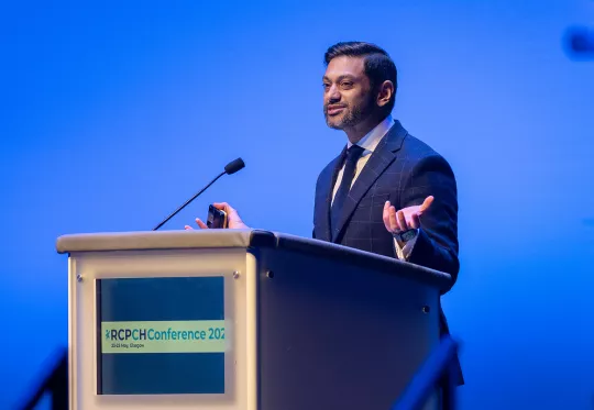 Professional man speaking at podium 