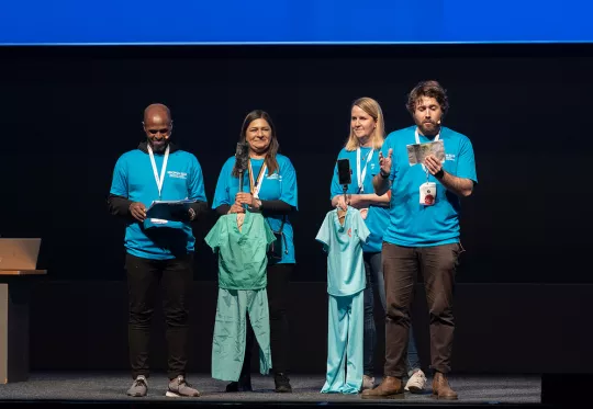 Conference speakers with mobile props