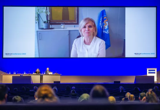 Female speaker on conference speaker