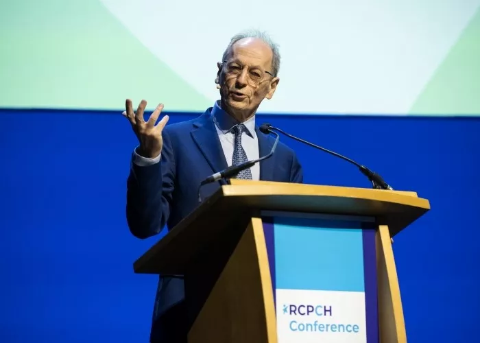 Professor Sir Michael Marmot speaking from a podium