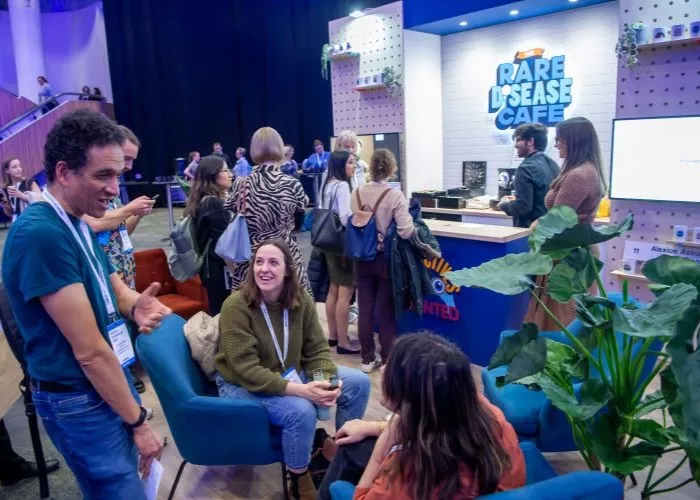 Group of people gathering and talking in a hall