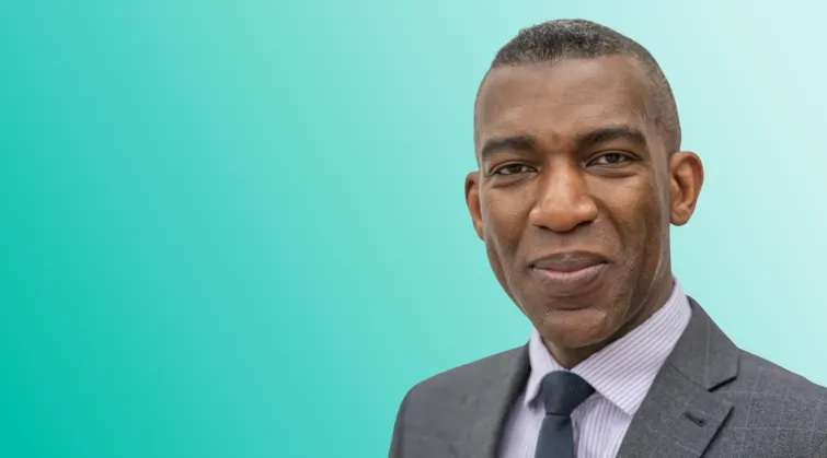 Headshot photo of Rob Okunnu