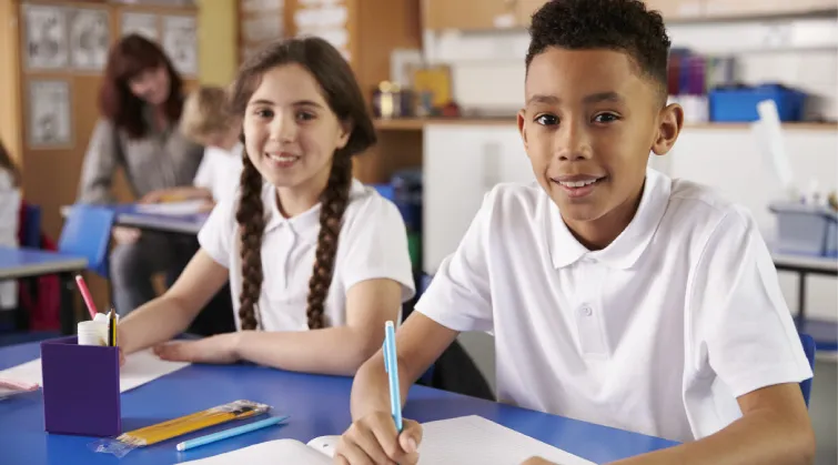 Two school children in a classroom