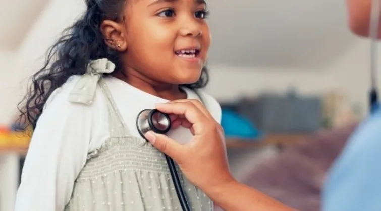 Young girl getting her heart checked with a stethoscope