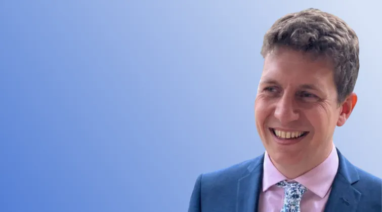 Thomas Isaac on blue background