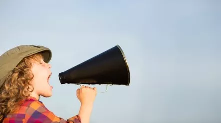 Child shouting into megaphone