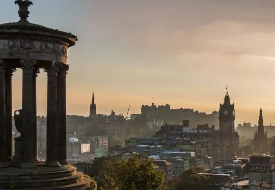 View from atop a hill at sunset