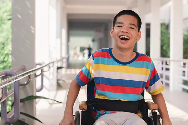 A disabled boy in a wheelchair 