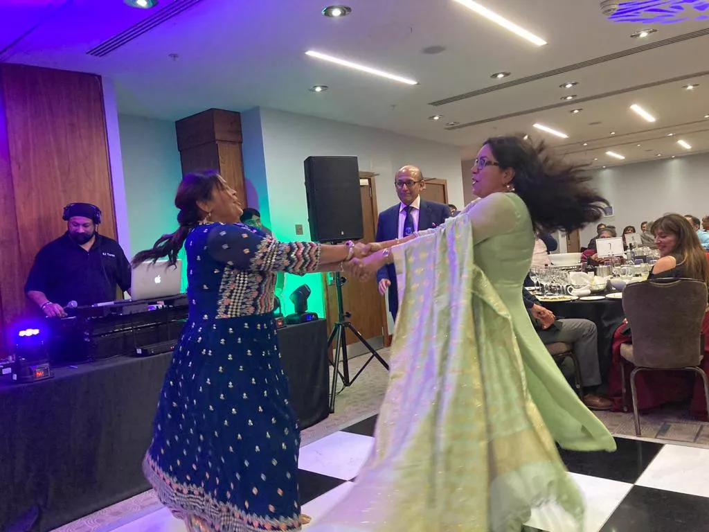 Two women dancing and spinning