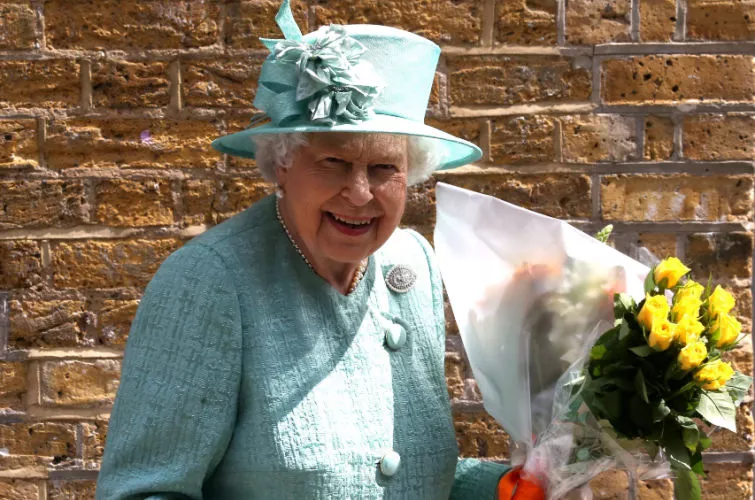 Queen Elizabeth II holding flowers