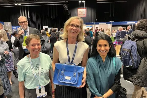 Camilla Kingdon holding The Blue Bag with Chinthika and Heather