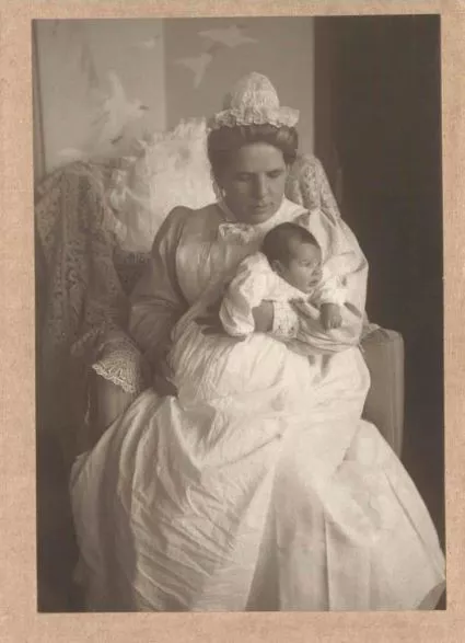 Harriett Cater holding a child