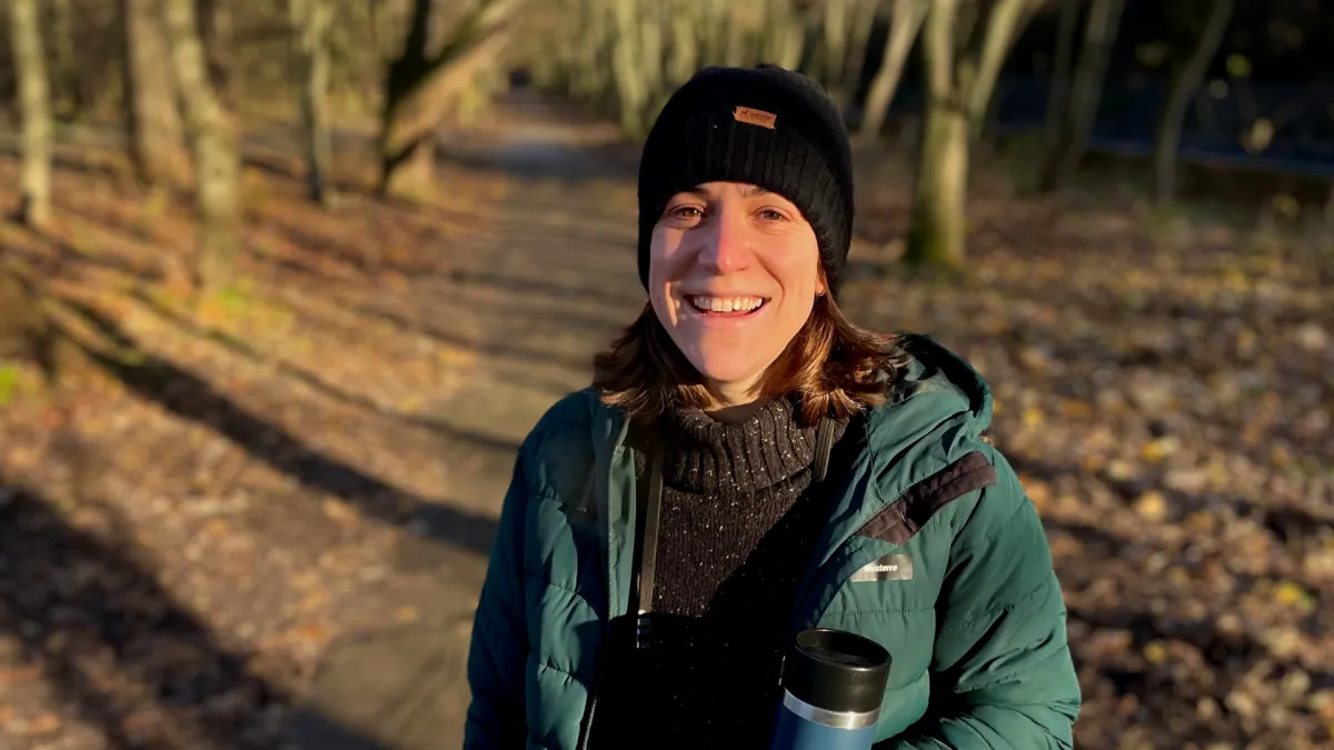 Photo of Emily Parker in a woodland area