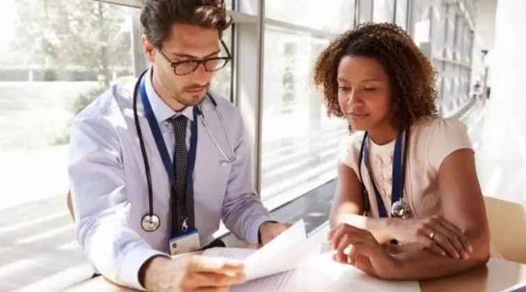 Two health professionals discussing