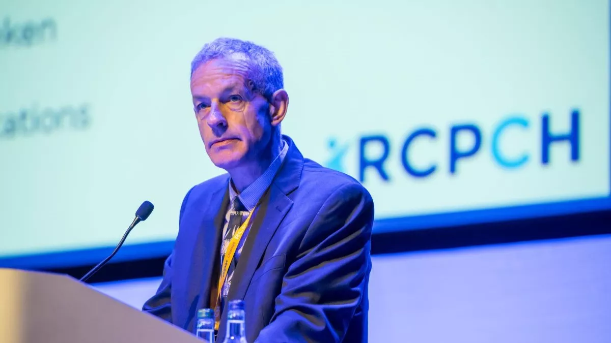 Steve Turner at microphone, with RCPCH slide behind