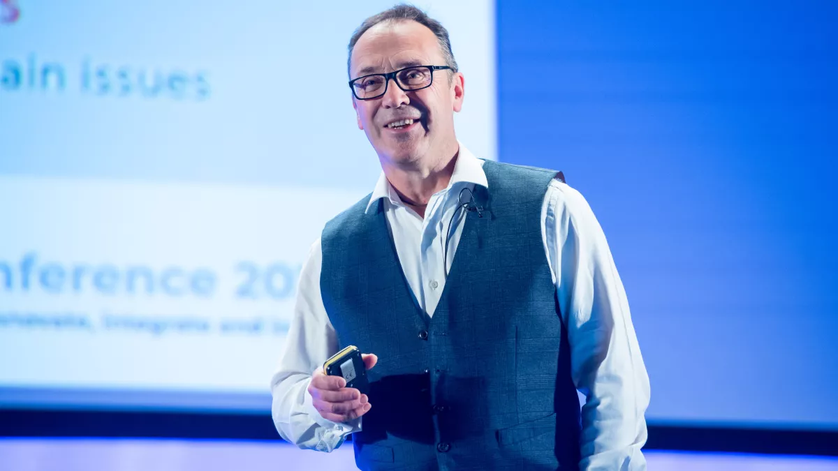 Stephen Tomlin speaking on stage