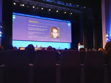 Picture of a powerpoint presentation about Ryan's Rule taken at conference