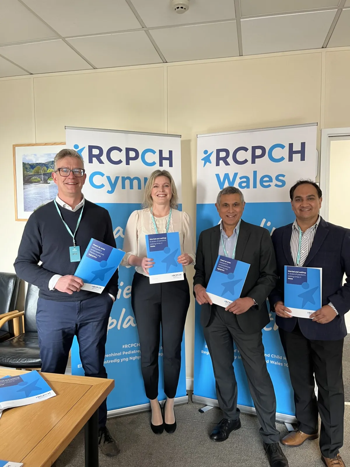 Picture of RCPCH Wales Officer and Deputy Officers with a RCPCH banner in the background