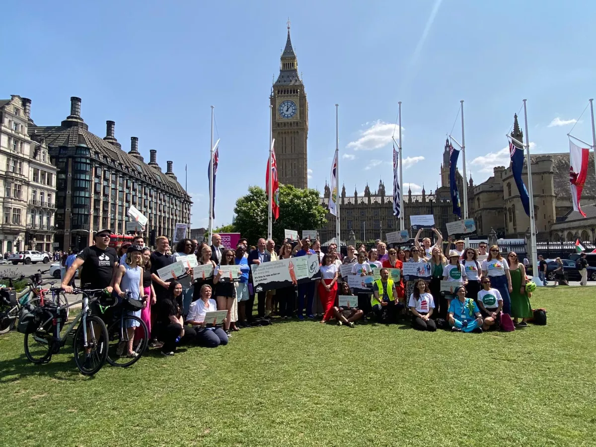 Group of people outside Houses of Parliament
