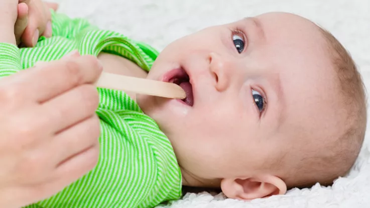 Baby being examined for cleft palate