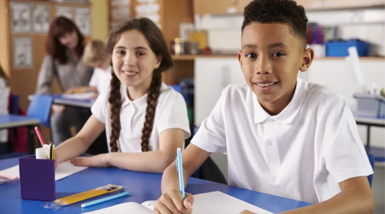 Two school children in a classroom