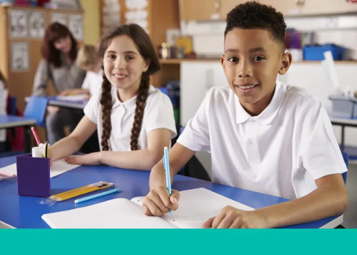 Two school children in a classroom