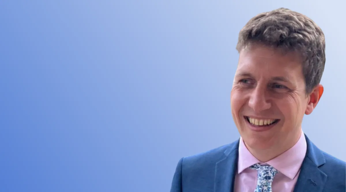 Thomas Isaac on blue background