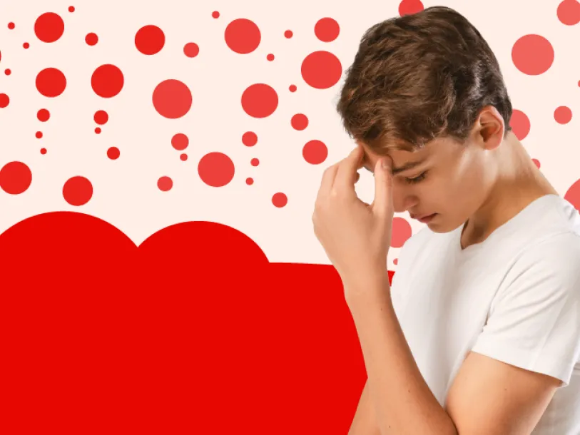 Think measles - boy with head in his hand - red dot background